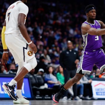 Apr 9, 2023; Denver, Colorado, USA; Sacramento Kings guard Terence Davis III (3) passes the ball as Denver Nuggets guard Reggie Jackson (7) guards in the fourth quarter at Ball Arena. Mandatory Credit: Isaiah J. Downing-USA TODAY Sports