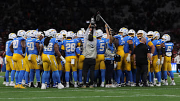 Los Angeles Chargers players in a huddle before game against the Kansas City Chiefs.