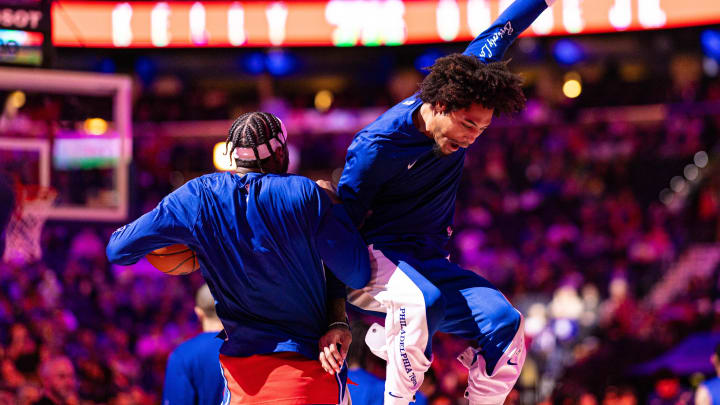 Apr 12, 2024; Philadelphia, Pennsylvania, USA; Philadelphia 76ers guard Kelly Oubre Jr. (R) reacts with guard Buddy Hield (L) during player introductions against the Orlando Magic at Wells Fargo Center. 