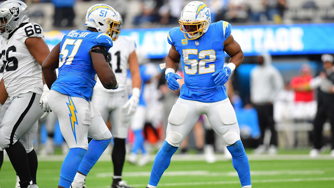 Oct 1, 2023; Inglewood, California, USA; Los Angeles Chargers linebacker Khalil Mack (52) reacts after sacking Las Vegas Raiders quarterback Aidan O'Connell (4) with defensive tackle Sebastian Joseph-Day (51) during the second half at SoFi Stadium. Mandatory Credit: Gary A. Vasquez-Imagn Images