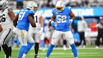 Oct 1, 2023; Inglewood, California, USA; Los Angeles Chargers linebacker Khalil Mack (52) reacts after sacking Las Vegas Raiders quarterback Aidan O'Connell (4) with defensive tackle Sebastian Joseph-Day (51) during the second half at SoFi Stadium. Mandatory Credit: Gary A. Vasquez-Imagn Images