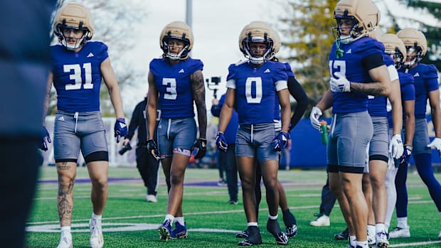 Luke Luchini (31) stands with Rashid Williams (3), Kevin Green Jr. (0) and Audric Harris (13) at spring practice.