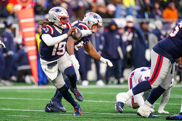 New Cowboys QB Joe Milton III looks to pass the ball against the Buffalo Bills while playing for New England.