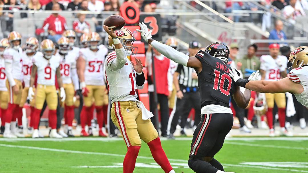 Nov 16, 2025; Glendale, Arizona, USA; San Francisco 49ers quarterback Brock Purdy (13) throws the ball in the first half while being defended by Arizona Cardinals outside linebacker Josh Sweat (10) in the first half at State Farm Stadium. Mandatory Credit: Matt Kartozian-Imagn Images Nov 16, 2025; Glendale, Arizona, USA; San Francisco 49ers quarterback Brock Purdy (13) throws the ball in the first half while being defended by Arizona Cardinals outside linebacker Josh Sweat (10) in the first half at State Farm Stadium. Mandatory Credit: Matt Kartozian-Imagn Images