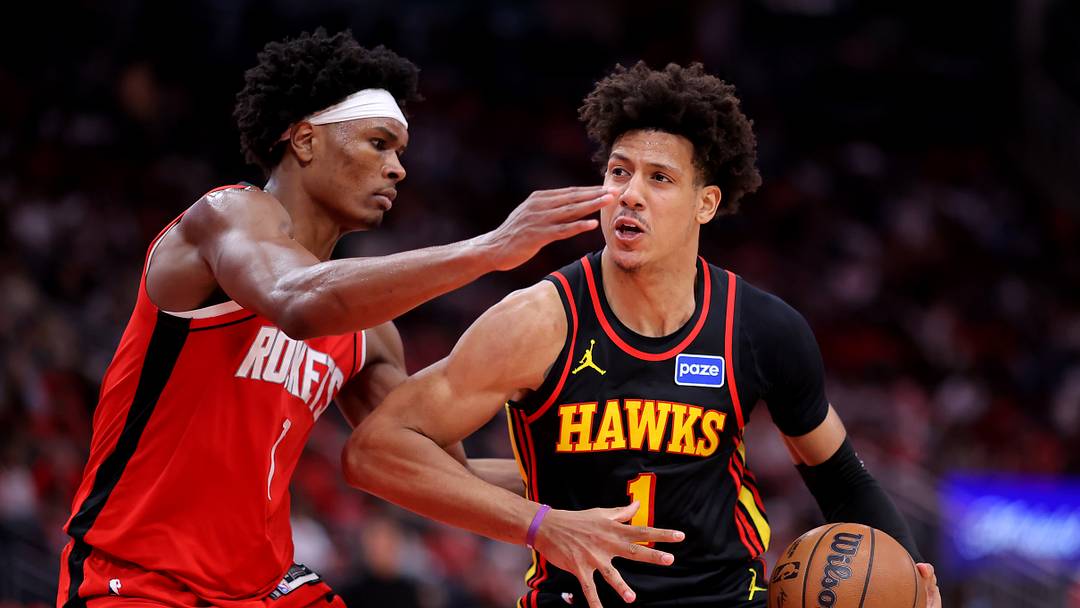 Mar 20, 2026; Houston, Texas, USA; Atlanta Hawks forward Jalen Johnson (1) drives to the basket against Houston Rockets guard Amen Thompson (1) during the fourth quarter at Toyota Center. Mandatory Credit: Erik Williams-Imagn Images