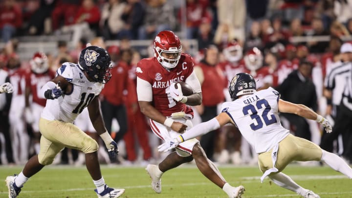 Nov 18, 2023; Fayetteville, Arkansas, USA; Arkansas Razorbacks quarterback KJ Jefferson (1) rushes in the second quarter as FIU Panthers linebacker Donovan Manuel (10) and defensive back Bobby Salla Jr (32) defend at Donald W. Reynolds Razorback Stadium. Mandatory Credit: Nelson Chenault-USA TODAY Sports