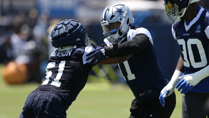 Jul 26, 2024; Oxnard, CA, USA; Dallas Cowboys defensive end Durrell Johnson (51) and linebacker Micah Parsons (11) block during training camp at the River Ridge Playing Fields in Oxnard, Californian. 