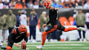 Nov 2, 2025; Cincinnati, Ohio, USA; Cincinnati Bengals placekicker Evan McPherson (2) kicks a 41-yard field goal held by punter Ryan Rehkow (8) against the Chicago Bears during the first quarter at Paycor Stadium. Mandatory Credit: Katie Stratman-Imagn Images