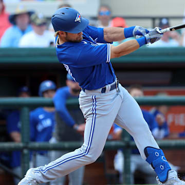 Mar 4, 2023; Lakeland, Florida, USA;  Toronto Blue Jays infielder Vinny Capra (47) hits a RBI double against the Detroit Tigers during the fourth inning at Publix Field at Joker Marchant Stadium. 
