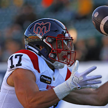 Jun 14, 2024; Edmonton, Alberta, CAN; Montreal Alouettes wide receiver Cole Spieker (17) catches a pass for a touchdown against the Edmonton Elks during the first half at Commonwealth Stadium. Mandatory Credit: Perry Nelson-Imagn Images