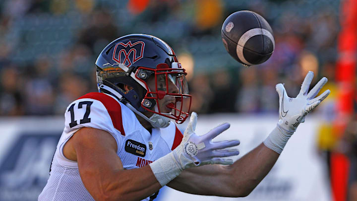 Jun 14, 2024; Edmonton, Alberta, CAN; Montreal Alouettes wide receiver Cole Spieker (17) catches a pass for a touchdown against the Edmonton Elks during the first half at Commonwealth Stadium. Mandatory Credit: Perry Nelson-Imagn Images