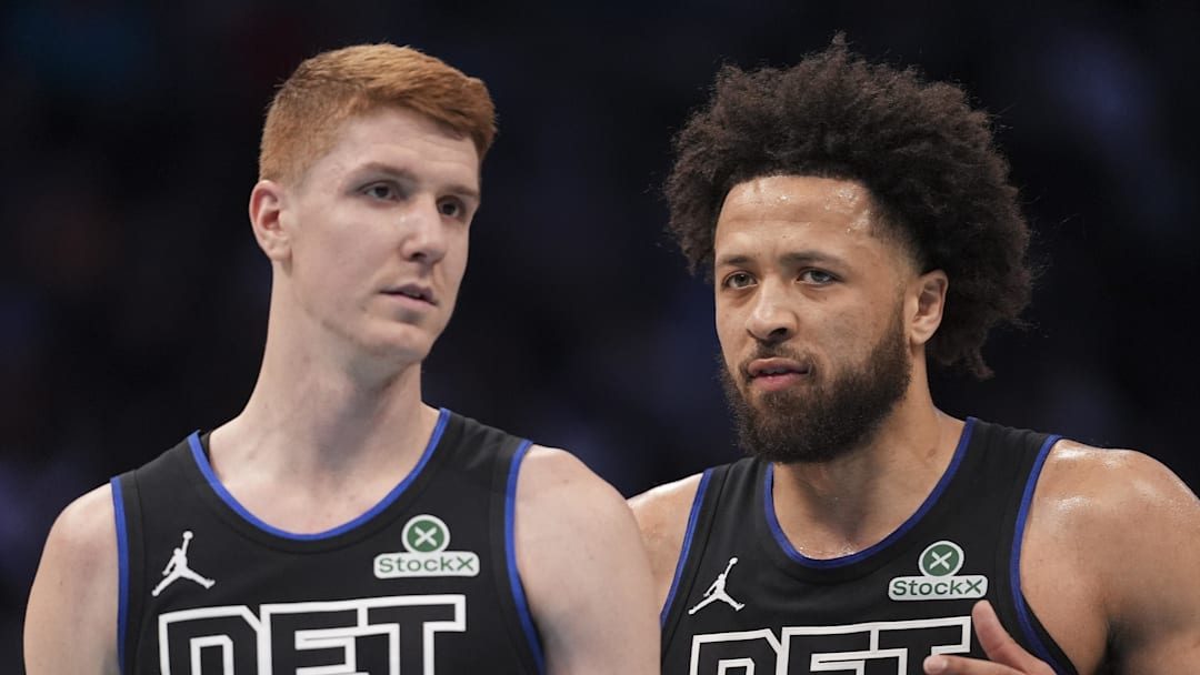 Feb 9, 2026; Charlotte, North Carolina, USA;Detroit Pistons guard Cade Cunningham (2) talks with guard Kevin Huerter (27) as he enters the game against the Charlotte Hornets during the second quarter at Spectrum Center. Mandatory Credit: Jim Dedmon-Imagn Images