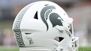 Sep 7, 2024; College Park, Maryland, USA; A detailed view of Michigan State Spartans helmet on the field before the game against the Maryland Terrapins at SECU Stadium. Mandatory Credit: Tommy Gilligan-Imagn Images