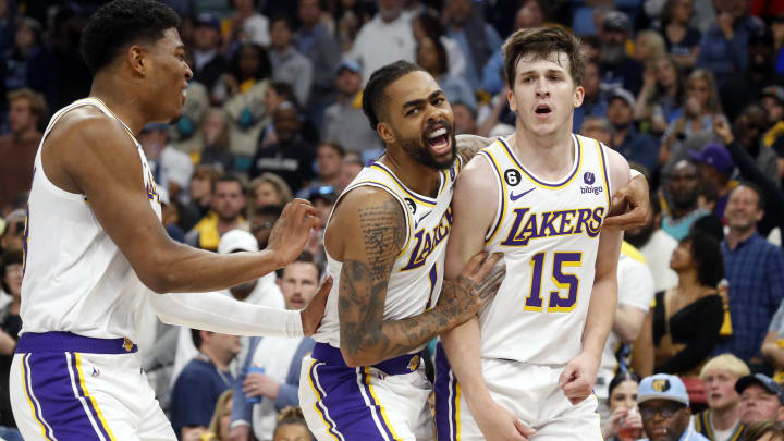 Apr 16, 2023; Memphis, Tennessee, USA; Los Angeles Lakers forward Rui Hachimura (28) and guard D'Angelo Russell (1) react with guard Austin Reaves (15) during the second half during game one of the 2023 NBA playoffs against the Memphis Grizzlies at FedExForum. Mandatory Credit: Petre Thomas-USA TODAY Sports