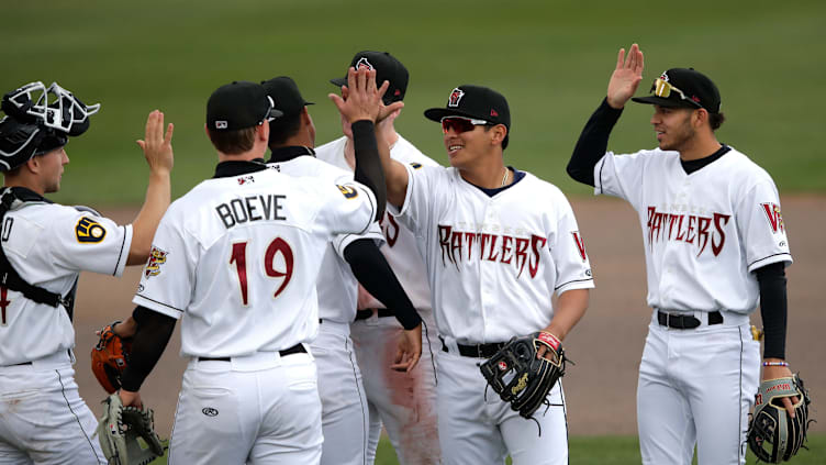 Wisconsin Timber Rattlers' baseball players celebrate a victory against the Cedar Rapids Kernels at