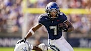Aug 30, 2025; East Hartford, Connecticut, USA; Connecticut Huskies running back Mel Brown (7) runs the ball against the Central Connecticut State Blue Devils in the first half at Pratt & Whitney Stadium at Rentschler Field. Mandatory Credit: David Butler II-Imagn Images