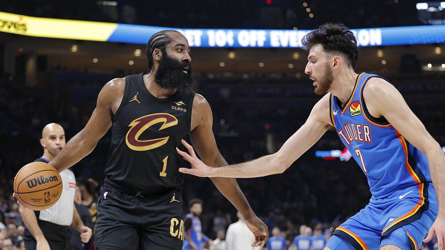 Cleveland Cavaliers guard James Harden moves the ball as Oklahoma City Thunder center/forward Chet Holmgren.