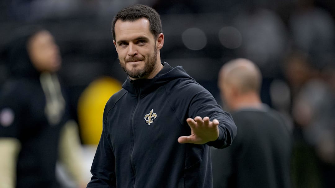 Dec 29, 2024; New Orleans, Louisiana, USA; New Orleans Saints quarterback Derek Carr (4) walks the field before a game against the Las Vegas Raiders at Caesars Superdome. Mandatory Credit: Matthew Hinton-Imagn Images