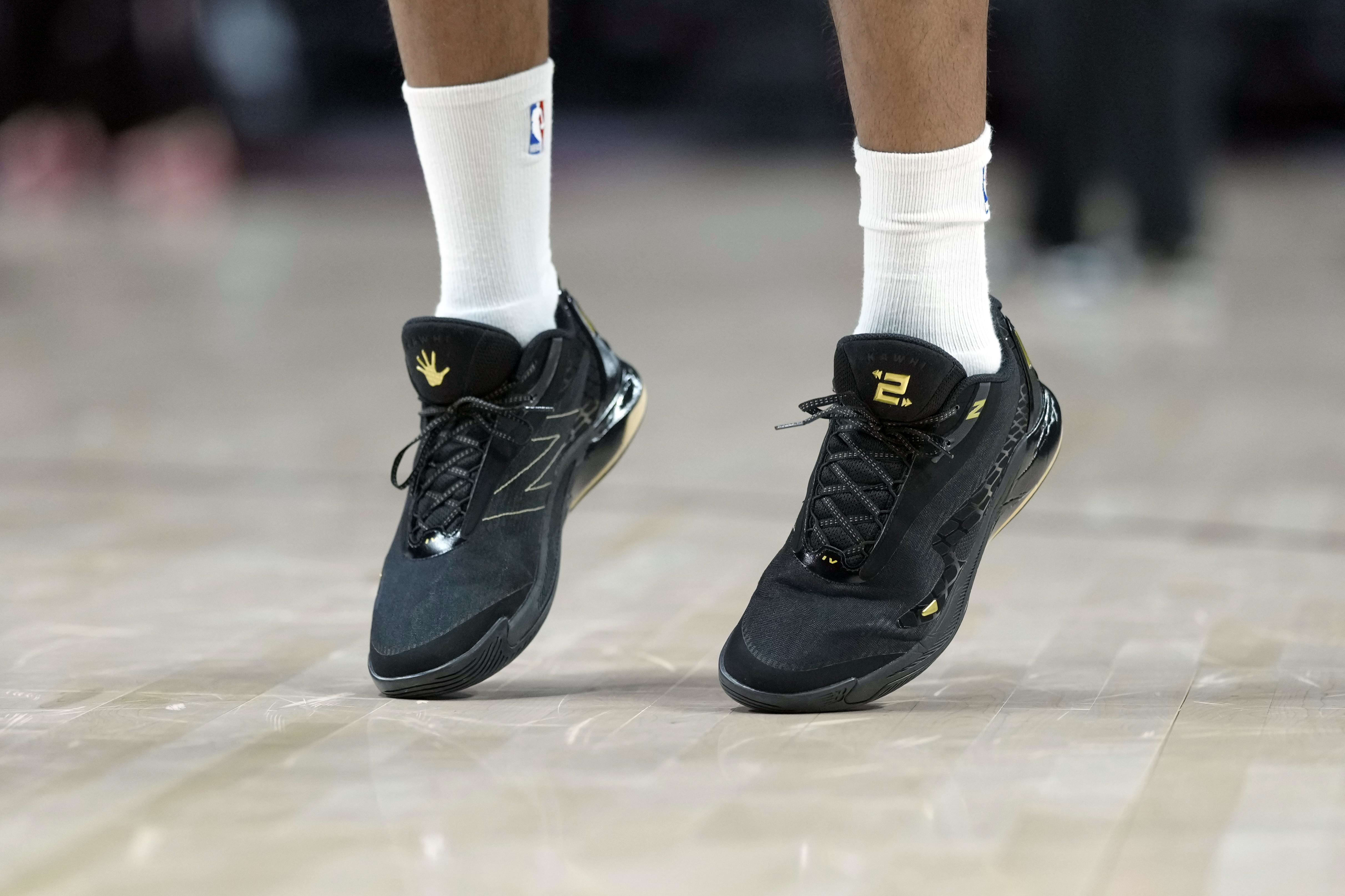 Kawhi Leonard's black and gold New Balance sneakers.