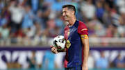 Jul 30, 2024; Orlando, FL, USA; Barcelona forward Robert Lewandowski (9) gets ready to take a penalty kick in a tie breaker during a Champions Tour friendly match against Manchester City at Camping World Stadium. Mandatory Credit: Nathan Ray Seebeck-Imagn Images