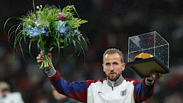 Harry Kane with his golden cap and flowers to celebrate 100 caps for England 