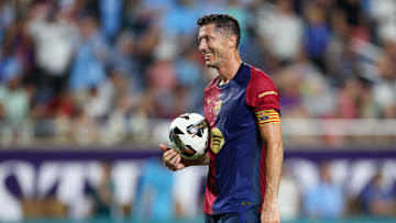 Jul 30, 2024; Orlando, FL, USA; Barcelona forward Robert Lewandowski (9) gets ready to take a penalty kick in a tie breaker during a Champions Tour friendly match against Manchester City at Camping World Stadium. Mandatory Credit: Nathan Ray Seebeck-Imagn Images