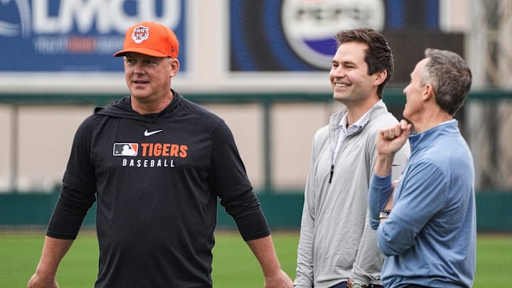 Detroit Tigers manager A.J. Hinch, left, talks to president of baseball operation Scott Harris, center, and team owner Chris Ilitch during spring training at Joker Marchant Stadium in Lakeland, Fla. on Thursday, Feb. 20, 2025.