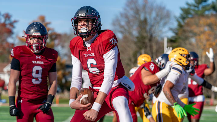 Tabor Academy quarterback Peter Bourque celebrates after scoring a touchdown in the opening drive.