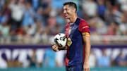 Jul 30, 2024; Orlando, FL, USA; Barcelona forward Robert Lewandowski (9) gets ready to take a penalty kick in a tie breaker during a Champions Tour friendly match against Manchester City at Camping World Stadium. Mandatory Credit: Nathan Ray Seebeck-Imagn Images