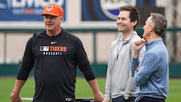 Detroit Tigers manager A.J. Hinch, left, talks to president of baseball operation Scott Harris, center, and team owner Chris Ilitch during spring training at Joker Marchant Stadium in Lakeland, Fla. on Thursday, Feb. 20, 2025.