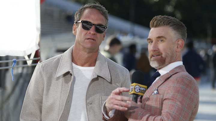 Nov 28, 2025; Starkville, Mississippi, USA; Mississippi Rebels head coach Lane Kiffin speaks with ESPN reporter Marty Smith before the game against the Mississippi State Bulldogs at Davis Wade Stadium at Scott Field. Mandatory Credit: Petre Thomas-Imagn Images