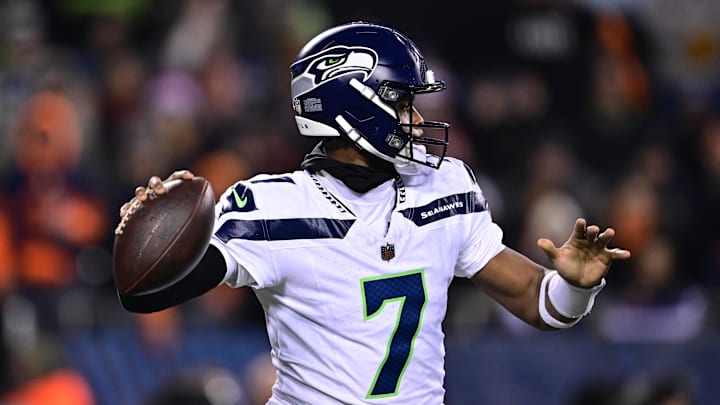 Dec 26, 2024; Chicago, Illinois, USA; Seattle Seahawks quarterback Geno Smith (7) looks to pass against the Chicago Bears during the second quarter at Soldier Field. Dec 26, 2024; Chicago, Illinois, USA; Seattle Seahawks quarterback Geno Smith (7) looks to pass against the Chicago Bears during the second quarter at Soldier Field.