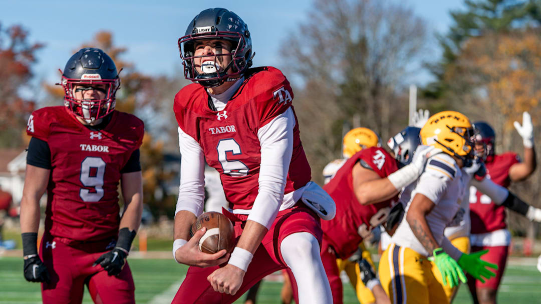 Tabor Academy quarterback Peter Bourque celebrates after scoring a touchdown in the opening drive.