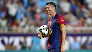 Jul 30, 2024; Orlando, FL, USA; Barcelona forward Robert Lewandowski (9) gets ready to take a penalty kick in a tie breaker during a Champions Tour friendly match against Manchester City at Camping World Stadium. Mandatory Credit: Nathan Ray Seebeck-Imagn Images
