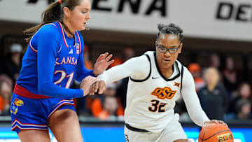 Oklahoma State Cowgirls guard Stailee Heard (32) tries to get past Kansas Jayhawks guard Elle Evans (21) during a women's BIG 12 basketball game between the Oklahoma State University Cowgirls (OSU) and the Kansas Jayhawks at Gallagher-Iba Arena in Stillwater, Okla., Saturday, Jan. 4, 2025.