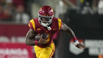 Oct 25, 2024; Los Angeles, California, USA; Southern California Trojans running back Woody Marks (4) carries the ball against the Rutgers Scarlet Knights in the second half at United Airlines Field at Los Angeles Memorial Coliseum. Mandatory Credit: Kirby Lee-Imagn Images