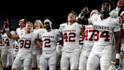The Oklahoma Sooners celebrate after beating Alabama.