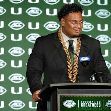 Jul 22, 2025; Charlotte, NC, USA; Miami offensive lineman Francis Mauigoa, Jr answers questions from the media during ACC Media Days at Hilton Charlotte Uptown. Mandatory Credit: Jim Dedmon-Imagn Images