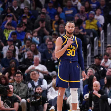 Apr 4, 2023; San Francisco, California, USA; Golden State Warriors guard Stephen Curry (30) and head coach Steve Kerr stand on the court during a break in the action against the Oklahoma City Thunder in the fourth quarter at the Chase Center. Mandatory Credit: Cary Edmondson-USA TODAY Sports