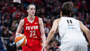 Indiana Fever guard Caitlin Clark (22) dribbles  the ball while Chicago Sky guard Kia Nurse (11) defends in the first half at Gainbridge Fieldhouse.