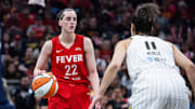 May 17, 2025; Indianapolis, Indiana, USA; Indiana Fever guard Caitlin Clark (22) dribbles the ball while Chicago Sky guard Kia Nurse (11) defends in the first half at Gainbridge Fieldhouse. Mandatory Credit: Trevor Ruszkowski-Imagn Images