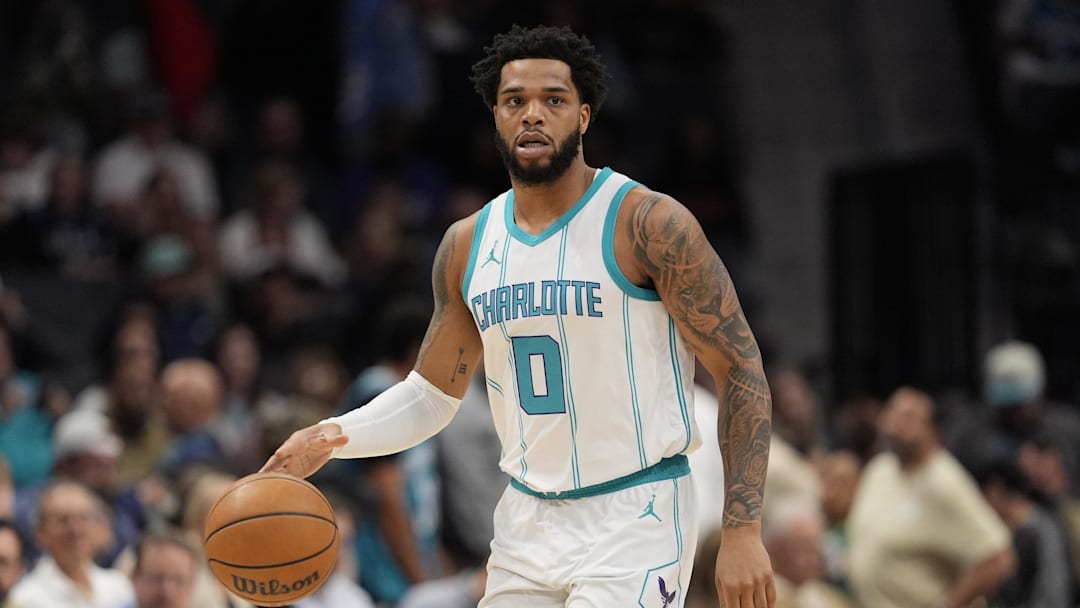 Mar 31, 2025; Charlotte, North Carolina, USA; Charlotte Hornets forward Miles Bridges (0) brings the ball up court against the Utah Jazz during the first quarter at Spectrum Center. Mandatory Credit: Jim Dedmon-Imagn Images