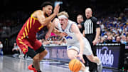 Mar 13, 2025; Kansas City, MO, USA; Brigham Young Cougars forward Richie Saunders (15) drives to the basket around Iowa State Cyclones forward Joshua Jefferson (2) during the first half at T-Mobile Center. Mandatory Credit: William Purnell-Imagn Images
