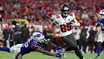Aug 23, 2025; Tampa, Florida, USA; Tampa Bay Buccaneers wide receiver Garrett Greene (85) runs past Buffalo Bills linebacker Jimmy Ciarlo (35) during the second half at Raymond James Stadium. Mandatory Credit: Kim Klement Neitzel-Imagn Images