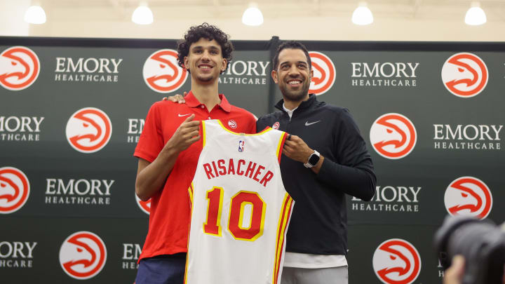 Jun 28, 2024; Atlanta, Georgia, USA; Atlanta Hawks first overall draft pick Zaccharie Risacher poses for a photo with general manager Landry Fields at the Emory Sports Medicine Complex. Mandatory Credit: Brett Davis-USA TODAY Sports