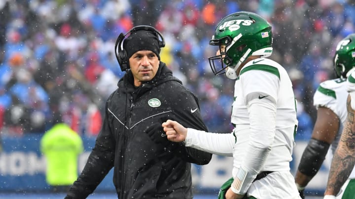 Dec 11, 2022; Orchard Park, New York, USA; New York Jets head coach Robert Saleh gives a fist bump to quarterback Mike White (5) after coming to the sideline after a minor injury in the second quarter against the Buffalo Bills at Highmark Stadium. 