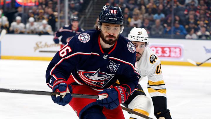 Columbus Blue Jackets right wing Kirill Marchenko and Boston Bruins defenseman Jonathan Aspirot skate after a loose puck during the first period at Nationwide Arena. Mandatory Credit: Russell LaBounty-Imagn Images
