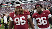 Oct 4, 2025; Tuscaloosa, Alabama, USA;  Alabama defensive lineman Tim Keenan III (96) and Alabama linebacker QB Reese (36) leave the field at Saban Field at Bryant-Denny Stadium. Alabama downed Vanderbilt 30-14. Mandatory Credit: Gary Cosby Jr.-Imagn Images
