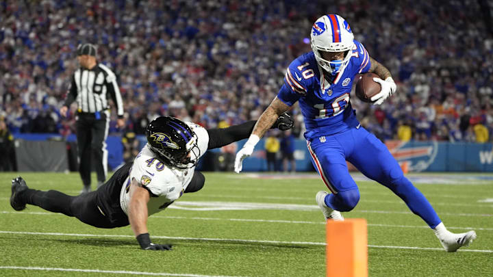 Sep 7, 2025; Orchard Park, New York, USA; Buffalo Bills wide receiver Khalil Shakir (10) runs with the ball against Baltimore Ravens linebacker Teddye Buchanan (40) during the first half at Highmark Stadium. Mandatory Credit: Gregory Fisher-Imagn Images