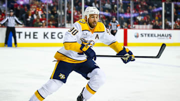 Jan 4, 2025; Calgary, Alberta, CAN; Nashville Predators center Ryan O'Reilly (90) skates against the Calgary Flames during the third period at Scotiabank Saddledome. Mandatory Credit: Sergei Belski-Imagn Images